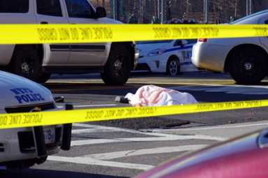 Detective from Highway patrol conducts an investigation where a 13 y/o was struck and killed by truck that fled the scene Police are still looking for the driver, identity of the child has not been released pending notification of the family. 12/28/12 Photo by Robert Stridiron Freelance. Contact 718-570-3390.
