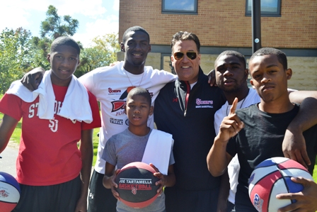 St. John’s men’s basketball head coach Steve Lavin (center) beat cancer and led the annual Dribble For The Cure event to raise awareness for the disease.