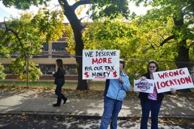 Residents protest the homeless shelter.