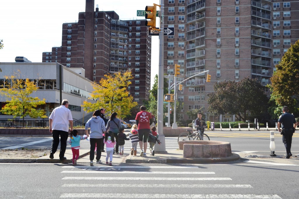 Students of the Towers Play-N-Learn nursery school cross Queens Boulevard where a man was critically injured in a hit-and-run early Thursday morning.