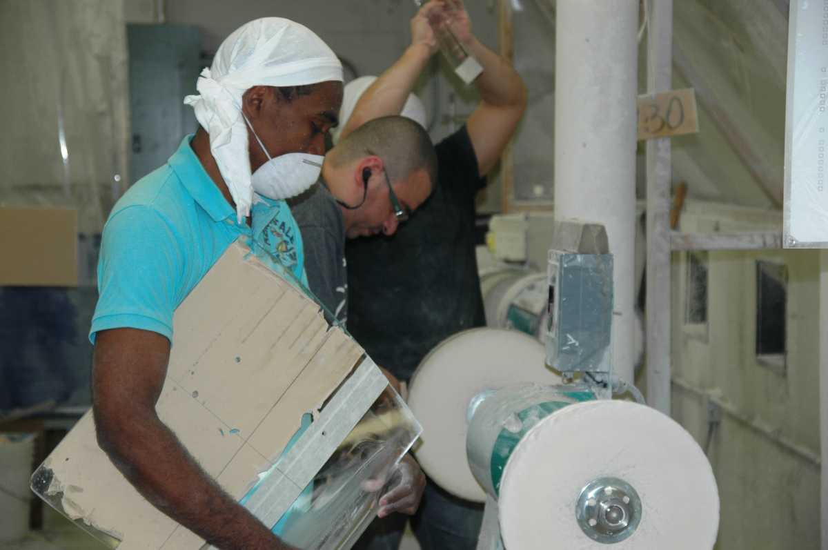 workers smoothing pexi glass