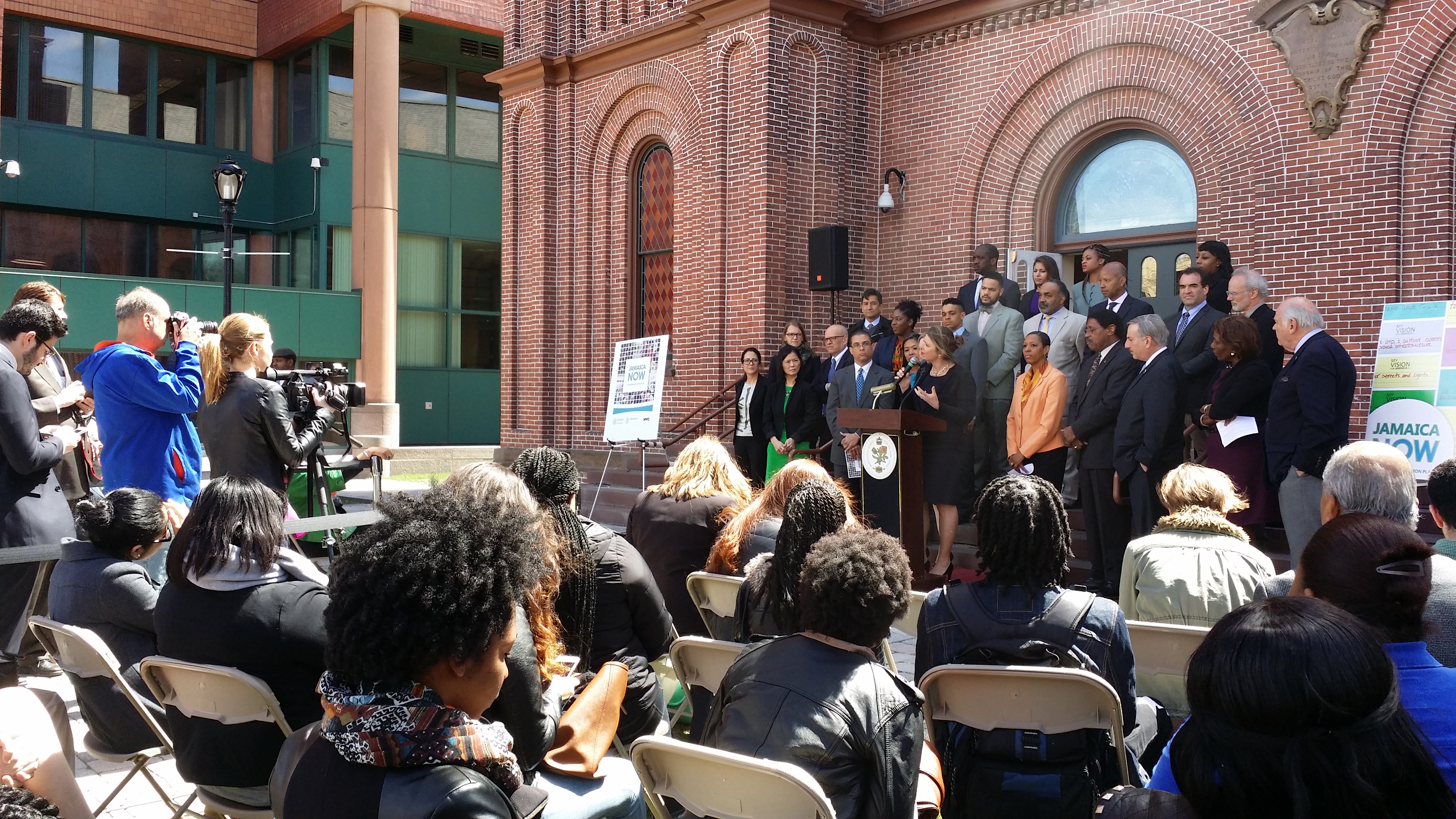 Deputy Mayor Alicia Glen talking to a crowd about the Jamaica Now Action Plan.