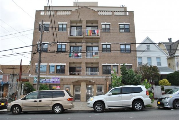 This four-story structure at 37-17/19 108th St. in Corona is on the market for $8.8 million.