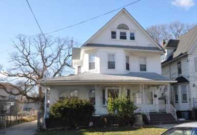 The Far Rockaway house where a woman allegedly rented a basement apartment to perform illegal cosmetic procedures.
