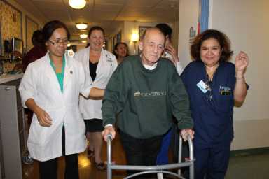 Frank Santos with staff of the Pavilion at Queens.