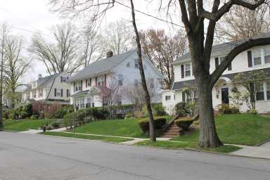 Many of the homes in Broadway-Flushing were developed by Rickert-Finlay Realty Company in the early 20th century. The developers attached restrictive deeds to the houses requiring peaked roofs and banning front yard fences.