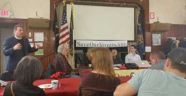 State Senator Joseph Addabbo (standing, at far left) addressed the Woodhaven Residents' Block Association meeting on Saturday.