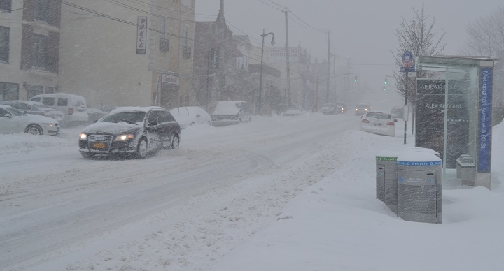 Metropolitan Avenue near 80th Street in Middle Village is nearly empty Saturday afternoon amid the ongoing Blizzard of 2016.