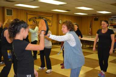 Female Whitestone residents utilizing techniques learned in the workshop.
