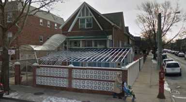 An instructor at a mosque inside this East Elmhurst home was charged Wednesday with sexually abusing a young girl.