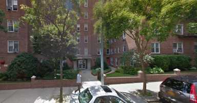 Police found a cache of weapons and ammunition inside an apartment in this Rego Park building this week.