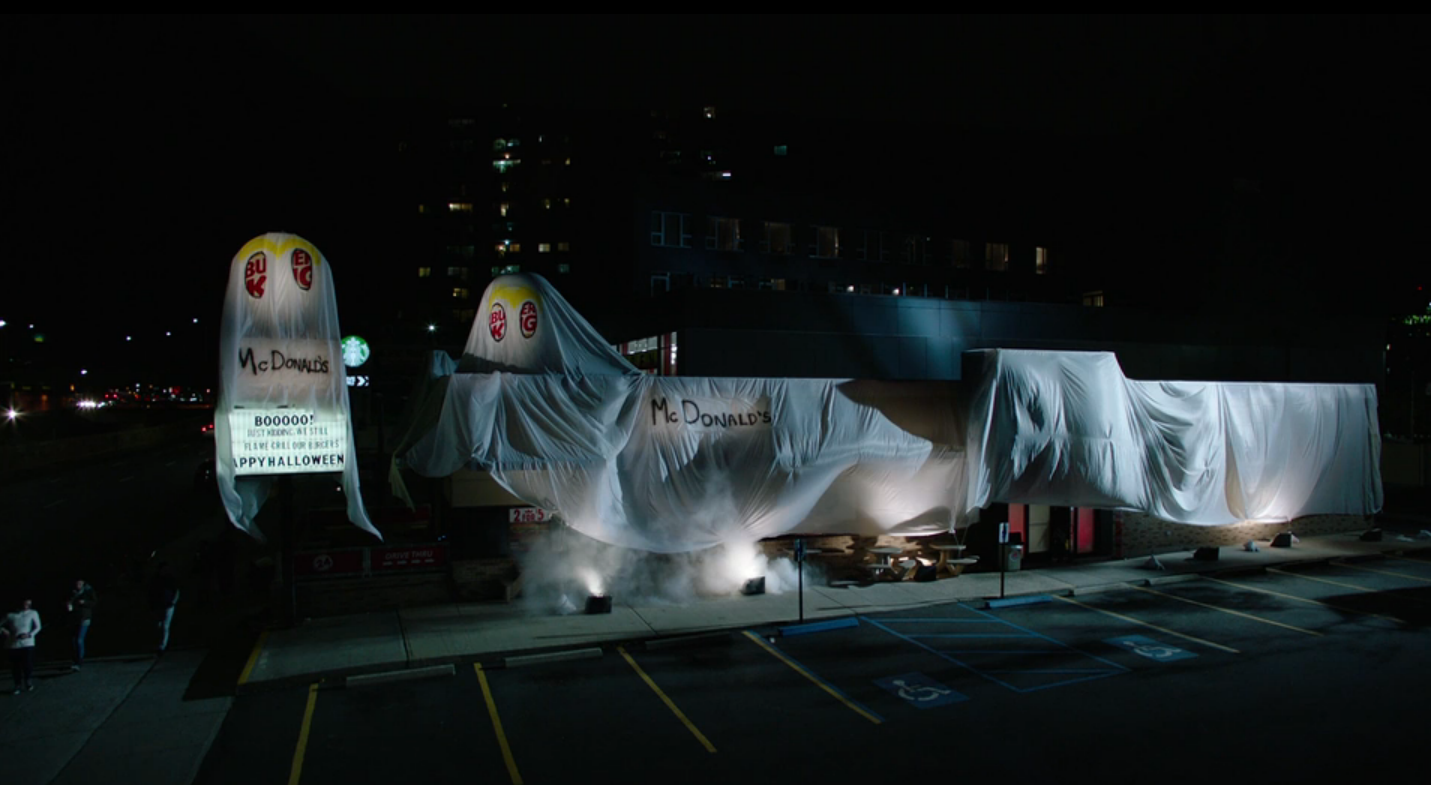 Burger King in the costume at night time