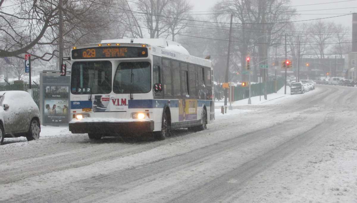 A Q29 bus passes along an empty and icy 80th Street in Middle Village on March 14.