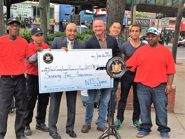 Two formerly homeless men hired to clean Roosevelt Avenue