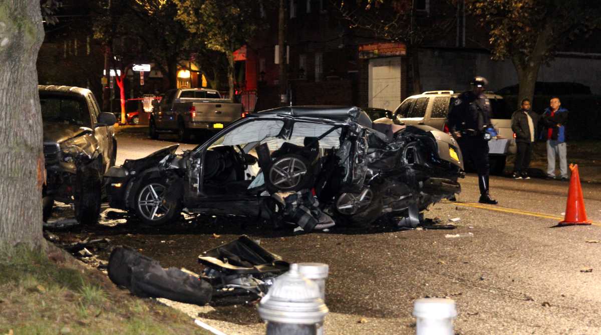 Police continue to investigate a deadly car crash in Ozone Park on Nov. 18.
