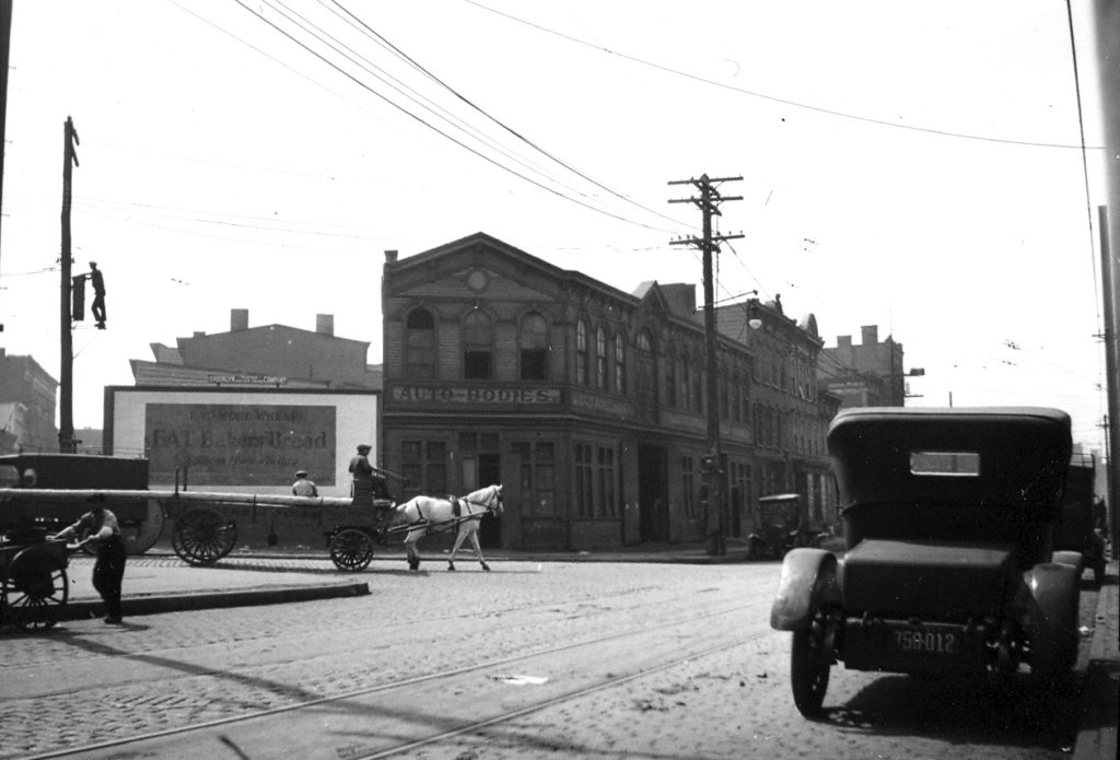 Horse-drawn wagons made most of the local deliveries during the 1920s, reader Catherine Almstadt recalls. This photo of Flushing Avenue at Beaver Street in Brooklyn was taken in 1923. Note the trolley tracks in the foreground.