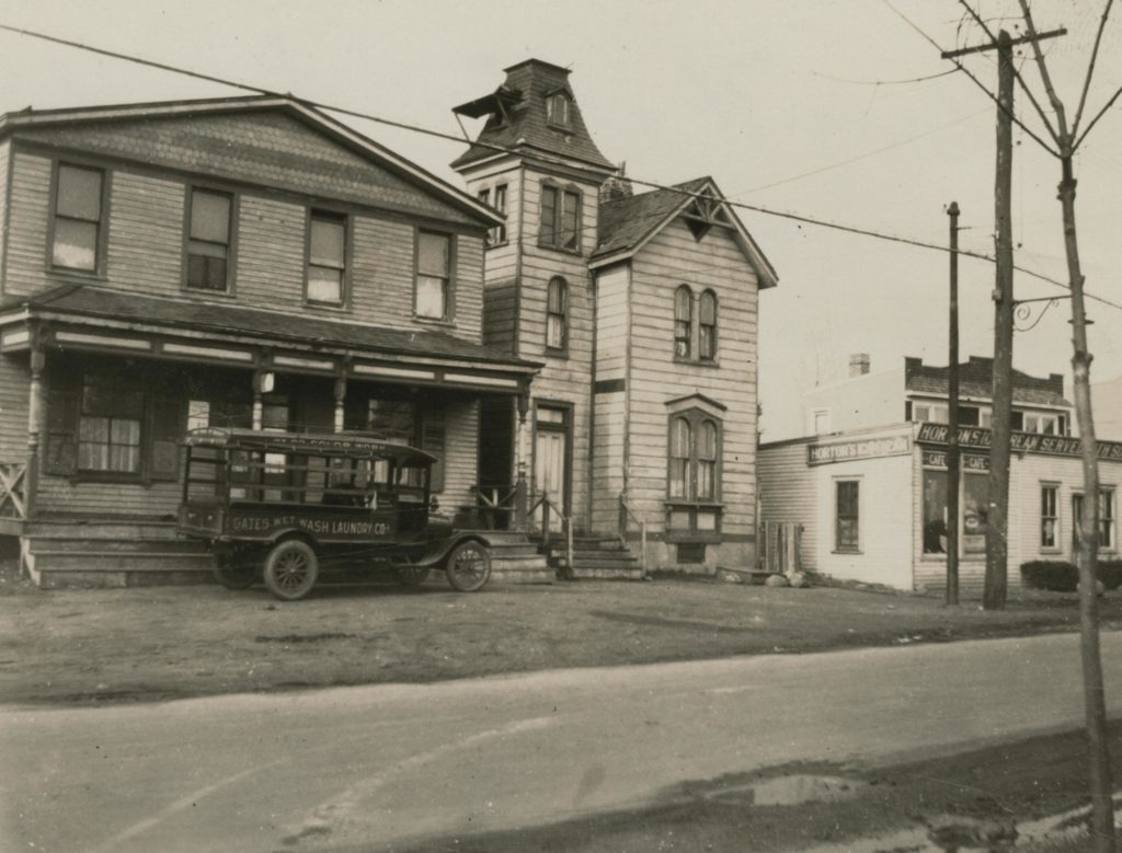 Buildings at the corner of Dry Harbor Road (present-day 80th Street) between Juniper Valley Road and Metropolitan Avenue in Middle Village are pictured in this 1922 image. (photo via Queens Library Digital Archives)
