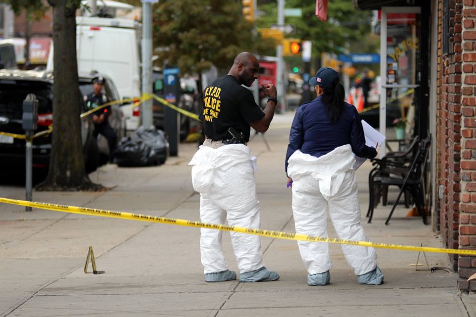 Crime scene investigators outside the Ozone Park business where Hani Kassem was murdered on Oct. 23, 2017.