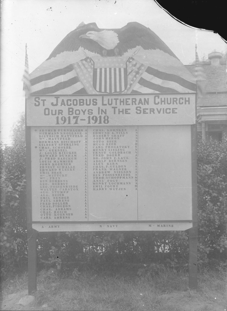 Communities across Queens listed the names of soldiers serving in World War I through "honor rolls" displayed across the borough. This one was posted outside of St. Jacobus Church in Woodside. (Courtesy of the Queens Borough Public Library, Archives, St. Jacobus Church Collection)