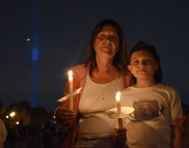 Last year's 9/11 memorial at Juniper Valley Park in Middle Village, with the Tribute in Light seen in the background.