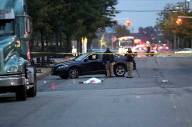 Police set up a crime scene where a man was shot to death outside the College Point Multiplex on Oct. 1.