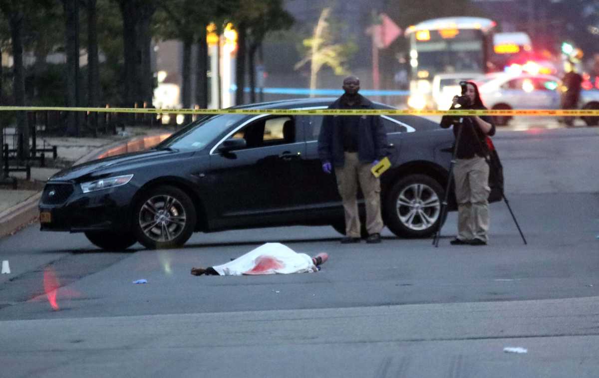 The body of Jaquan Campbell lies on Ulmer Street after he was shot to death on Oct. 1.