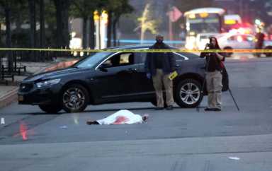 The body of Jaquan Campbell lies on Ulmer Street after he was shot to death on Oct. 1.