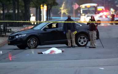 The body of Jaquan Campbell lies on Ulmer Street after he was shot to death on Oct. 1.