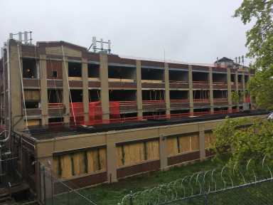 The former factory at 78-16 Cooper Ave. in Glendale is shown undergoing renovation in this April 2019 photo.