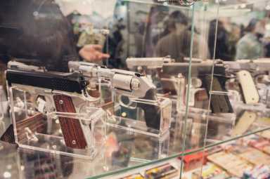Guns on a show-window of shop. Weapon