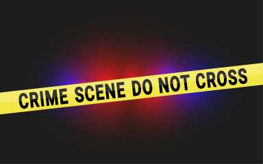 Crime Scene Do Not Cross Tape with Police Flashing Lights