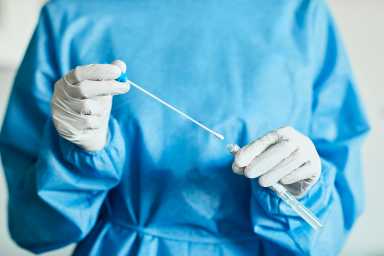 Doctor/Nurse with Swab Test Sample in Hospital, PCR Device