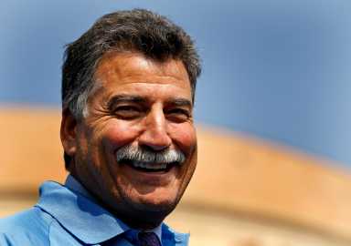 Former New York Mets All-Star Hernandez smiles prior to having his moustache shaved for charity in front of CitiField in New York
