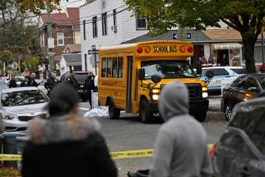 People look on at a fatal accident at 107 Avenue and 86 Street.