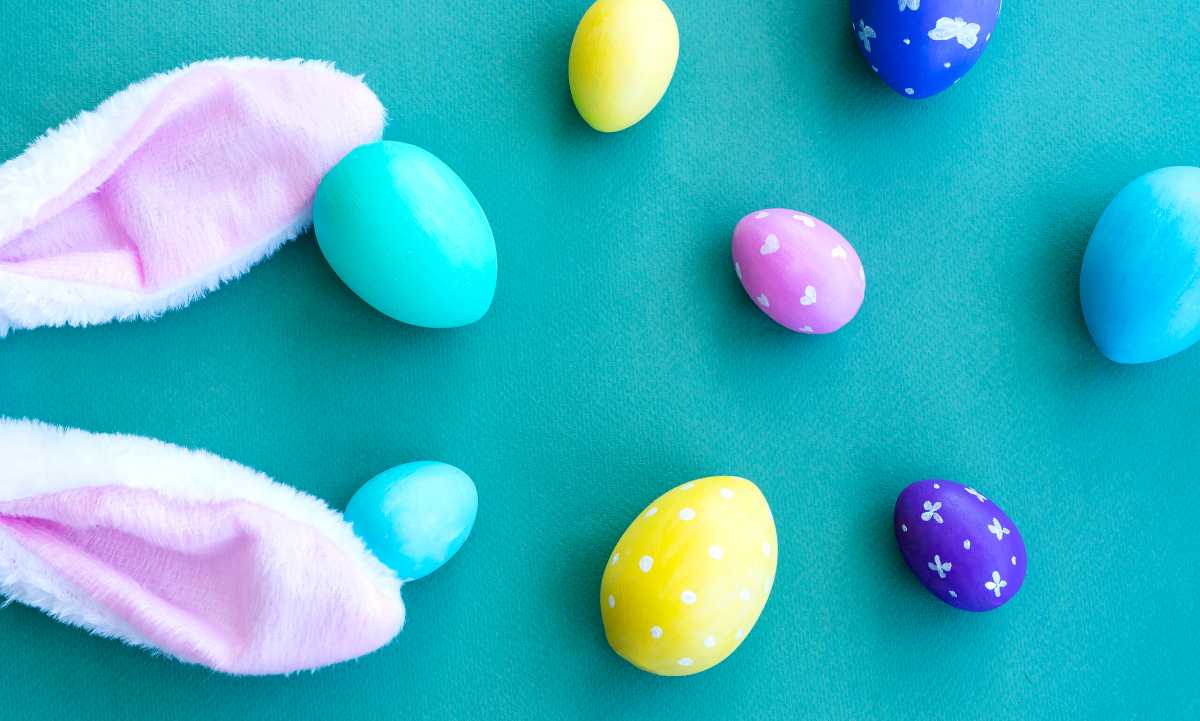 Easter composition. Multicolored Easter eggs and bunny ears