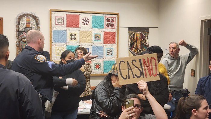 NYPD officers attempt to restore order at Thursday's meeting. Photo: Shane O'Brien
