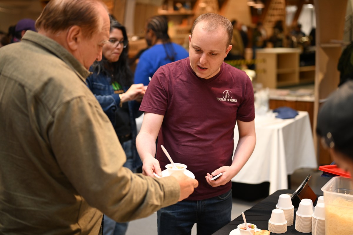 Chad Goldsmith serves guests at the 2025 Queens Taste. Photo Ramy Mahmoud. 