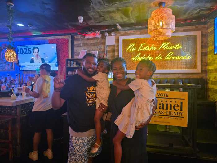 Shanel Thomas-Henry with her family at a District 21 election watch-party at Vibras Restaurant & Lounge on Astoria Boulevard. Photo: Shane O'Brien.