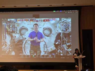 NASA astronaut Dr. Jonny Kim speaks to U.S. Rep. Grace Meng at NYSCI's auditorium on Friday. Photo: Shane O'Brien.
