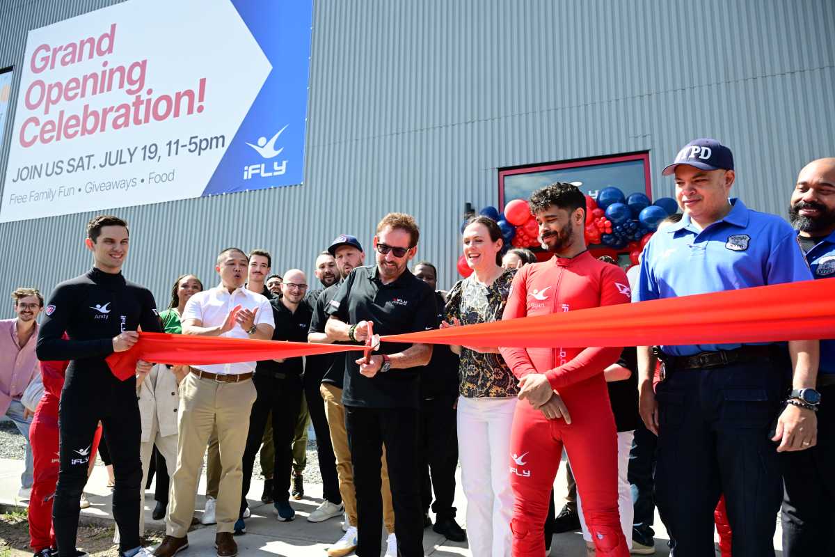 iFly representatives and members of the LIC business community host a ribbon-cutting ceremony at the company's new LIC facility. Photo: Ramy Mahmoud.
