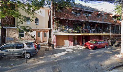A neighbor from a first-floor apartment in this three-family home in Elmhurst found the victim with more than half a dozen stab wounds to his chest.